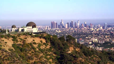 Los Angeles, CA / USA - July 3, 2016: Griffith Park Observatory and view of Downtown Los Angeles by Aerial Drone