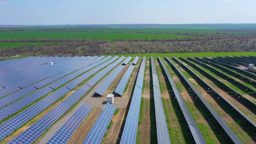Green energy farm. Solar pannels in the field. Eco energy concept | Shutterstock HD Video #1028254541