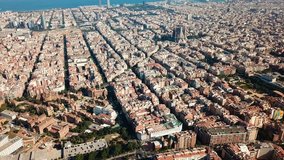 Panoramic view of historical districts of Barcelona with Mediterranean in cloudy day