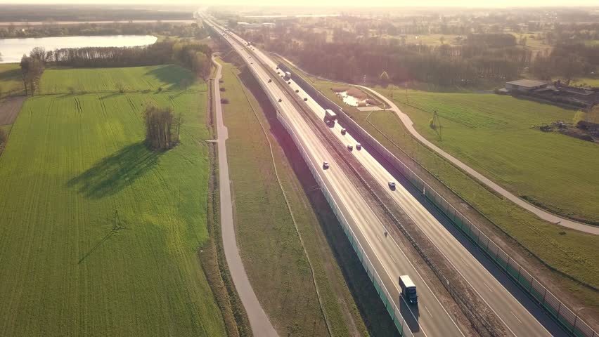 Traffic on freeway seen from above. Drone footage of highway in Europe.