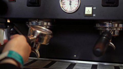 Coffee machine. Barista brews coffee. Coffee house. Ground grain. Drink freshly brewed coffee in the morning. Invigorating fragrance. Cappuccino, milk, arabica. Keep the workplace clean. Own business