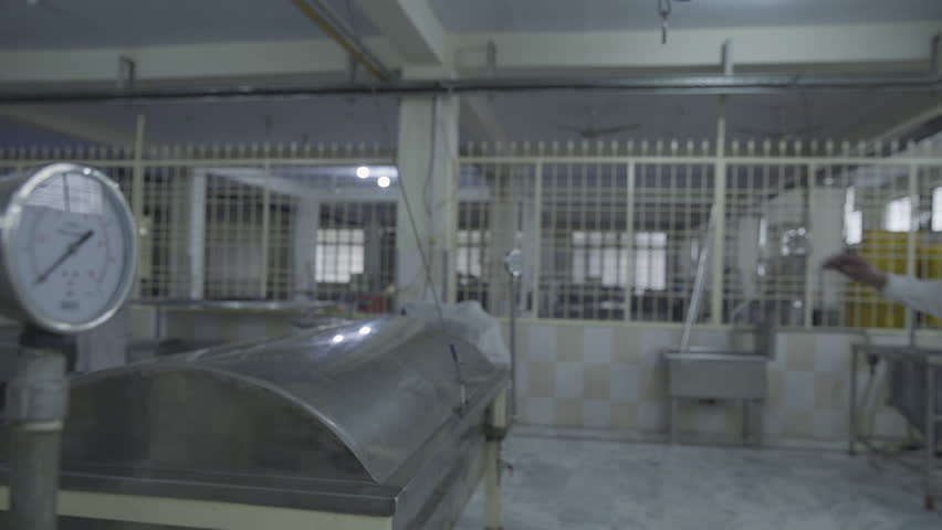 Ready Meal Production line in a factory, A chef is checking the machine of cooked meal