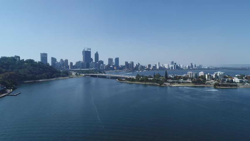 Aerial views over the Swan River, Mounts Bay Road with Kings Park and the skyline of Perth Western Australia