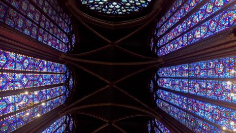 Paris, France-14 January, 2018: 4K, View interior of the famous Saint Chapelle, details of beautiful glass mosaic windows. Holy Chapel is a one of the most beautiful and tourist visited landmark-Dan