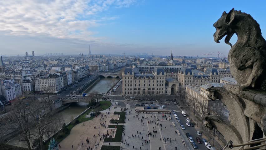 4K, Famous gargoyle statue in Notre Dame Cathedral with city of Paris background. Stone chimera watch over Paris, France. Famous touristic places and popular travel destinations of Europe-Dan