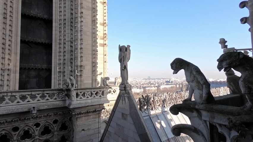 4K, Statue and gargoyle on the roof of Notre Dame cathedral in Paris while observing the city from top of church. Gothic French cathedral. Famous touristic places and popular travel destinations-Dan