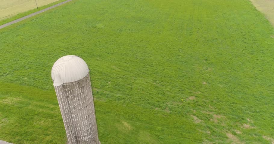 Old Farm Silo with Highway in Background Aerial Drone