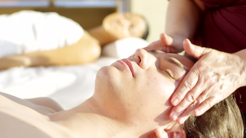 Lockdown of young Caucasian man lying on massage table in spa center and enjoying facial massage | Shutterstock HD Video #1028277377