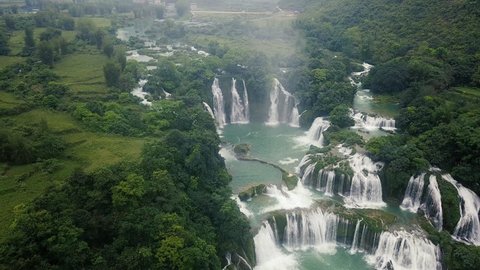 Ban Gioc waterfall or Detian waterfall is a collective name for two waterfalls in border Cao Bang, Vietnam and Daxin County, China. Royalty high-quality free stock footage of a beautiful waterfall