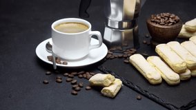 Italian Savoiardi ladyfingers Biscuits and cup of coffee on concrete background