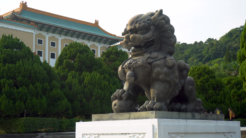 Ancient Chinese Guardian Lion Statue in Temple