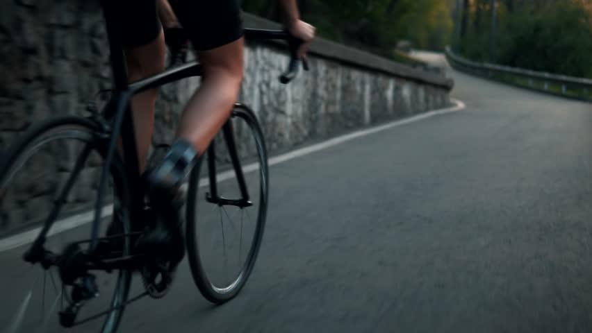 Cyclist Riding On Road Bike. Cycling Triathlete Pedaling Road Bicycle. Workout Outdoors And Endurance Cardio Exercise. Triathlon Athlete Strong Legs Ride On Bike. Cyclist Sportsman Intensive Training Royalty-Free Stock Footage #1028291177
