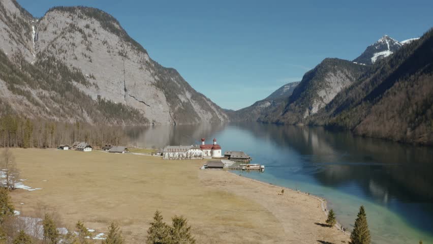 Lake Konigssee , Berchtesgaden national park in Germany surrounded by snowy Alps mountains, aerial view.
