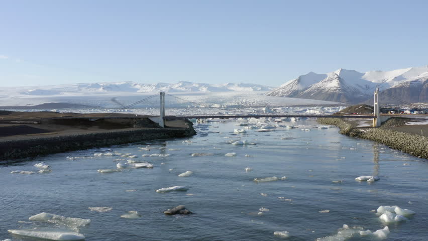 Flight Along the River Leading to Glacier Lagoon and Under the Bridge