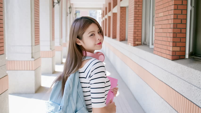 slow motion - asian college student smile to you