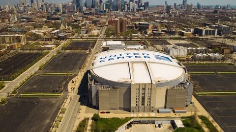 Chicago, Illinois / USA - April 21, 2019: Hyperlapse over United Center - Camera Reveal Chicago Skyline [4k]