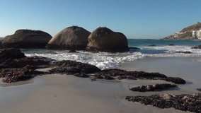 HD high quality summer afternoon video footage of spectacular Clifton Beach, rocks on shore, Atlantic Ocean white sand beach and mountain views in Western Cape near Cape Town, South Africa