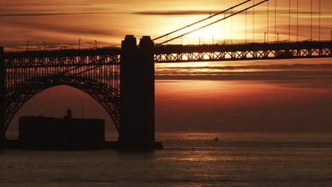 Aerial sunset view of Fort Point historic site Golden Gate road Bridge San Francisco at dusk air polluted red sky from wildfires USA RED WEAPON