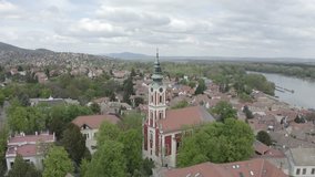 Church of the Assumption, Belgrade Cathedral, Szentendre, Hungary aerial drone panoramic view. RAW footage for creators to color grade and control the look of your project (dlog, d log).