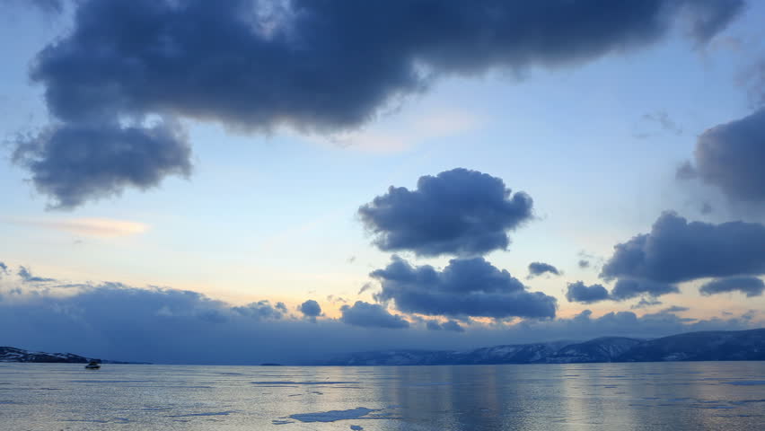 4K. Sunset in the icy Lake Baikal, Irkutsk region, Russia. Ultra HD, 4096x2304