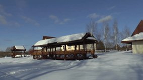 Observing panorama video at winter of wooden houses and snowy forest village 