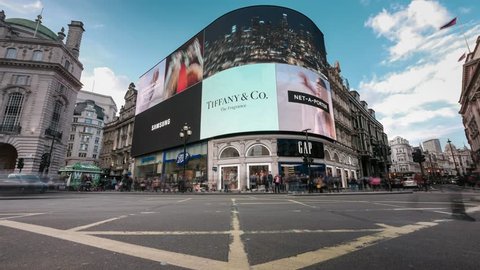 LONDON- APRIL, 2019: Time lapse of the giant advertising screens at Piccadilly Circus, a major London landmark at the cross roads between Soho, Mayfair and St James 