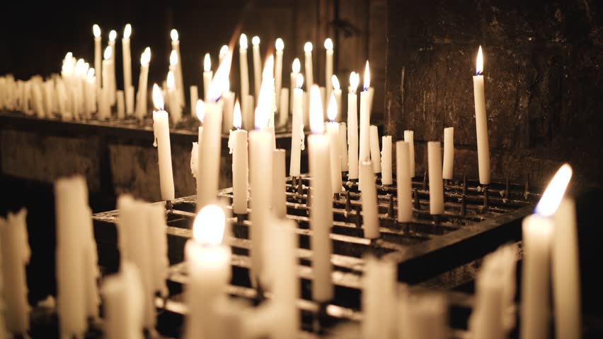 Burning candles in a church, Purgatory and prayer candles, 4k footage
