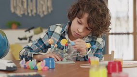 Painting of Model by Small Man. Paintbrush in Hand of Sitting School Pupil in House Room. Educational Draw for Create Environment. Future Life Concept. Homework of Artist and Star Travel of Dreamer - Powered by Shutterstock - Get 15% off with code: PIKWIZARD15