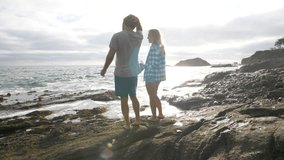 Man and Woman on the Rocks at the Beach - Powered by Shutterstock - Get 15% off with code: PIKWIZARD15