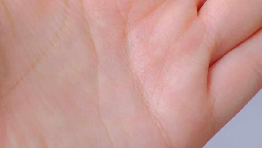 Extreme closeup of hand, skin detail. Palmistry concept. top view | Shutterstock HD Video #1028388836