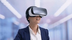 Excited office worker wearing virtual reality headset, future innovation, gadget