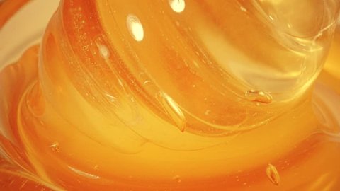 Glass honey dipper, slow motion close-up shot : vidéo de stock