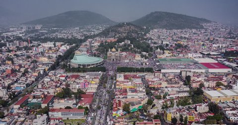 Aerial orbit hyperlapse of a big crowd in the Basilica of Guadalupe in the celebration of the 12 of December in Mexico City
