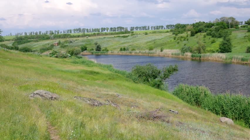 Ukrainian country landscape with small river Sura at summer season