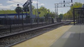 This is a clip of a busy street that passes over a train track.