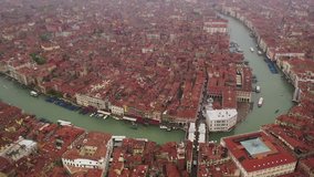 Aerial drone video of iconic and unique Grand Canal crossing city of Venice as seen from high altitude, Italy