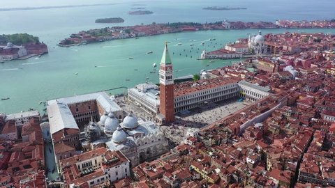 Aerial drone panoramic video of iconic Saint Mark's square or Piazza San Marco featuring Doge's Palace, Basilica and Campanile, Venice, Italy