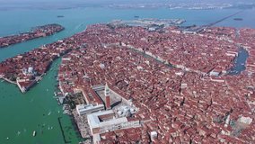 Aerial drone top view video of iconic Saint Mark's square and Grand Canal in city of Venice as seen from high altitude, Italy
