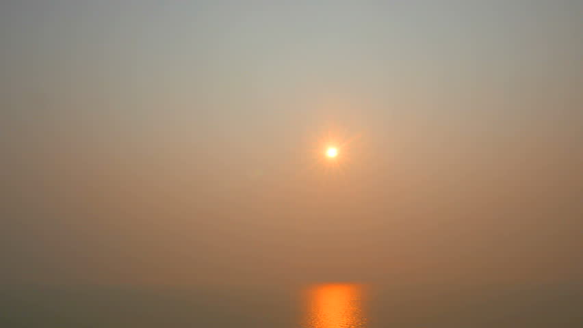 Static time-lapse shot of a gorgeous sunrise over the ocean.