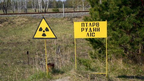 Warning signs of radioactive hazard. Chernobyl. Red Forest