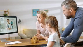 Medium shot of caring family with cute guinea pig talking to online vet via video call on computer