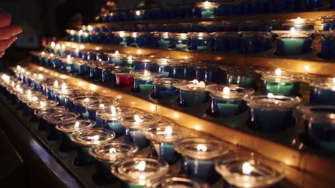 Prayer Woman Placing Her Candle Between Stock Footage Video (100%