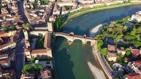 Aerial drone panoramic video from iconic city of Verona, Adige river and fortified medieval castle of Castelvecchio, Verona, Italy