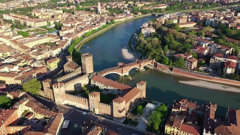 Aerial drone panoramic video from iconic city of Verona, Adige river and fortified medieval castle of Castelvecchio, Verona, Italy