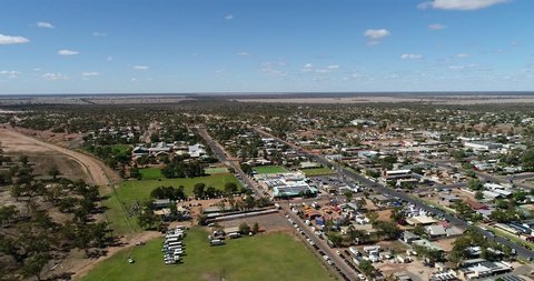 Lightning ridge small regional remote town - centre of opal mining industry in Australia. Aerial elevated view over flat plains and town streets.