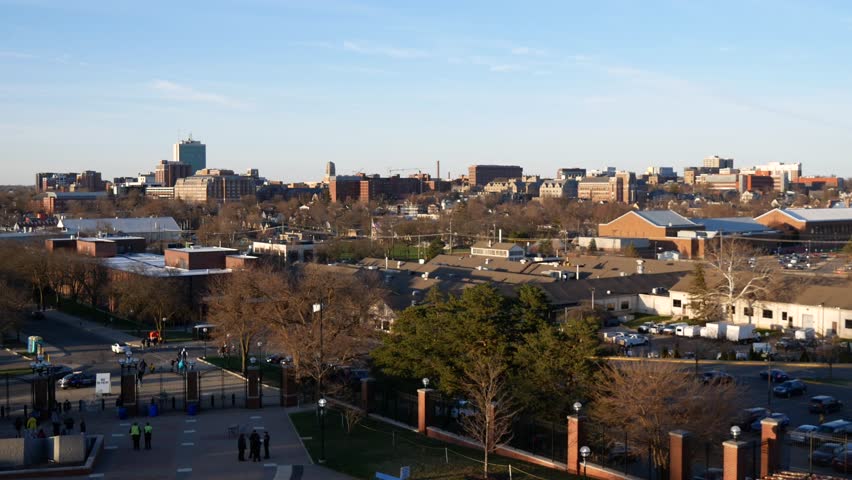 The view of the cityscape of Ann Arbor, Michigan during sunset on a clear day.