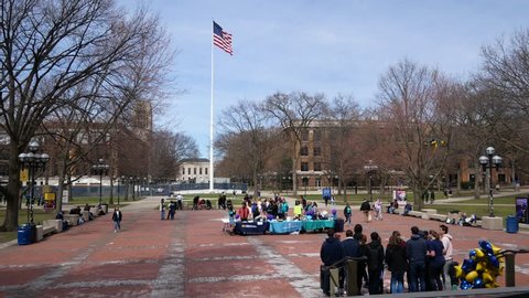 ANN ARBOR, MICHIGAN / USA - April 13, 2019: The University of Michigan central campus diag during a sunny day in the Spring.