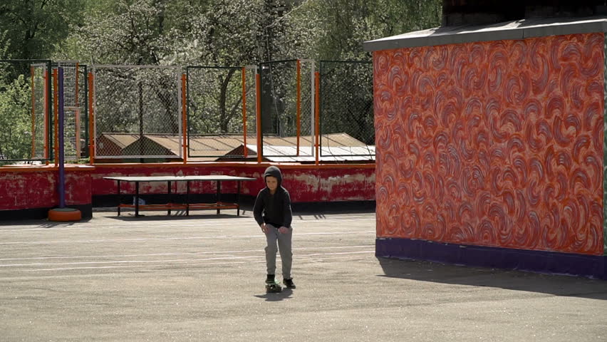 Boy learn to ride a skateboard