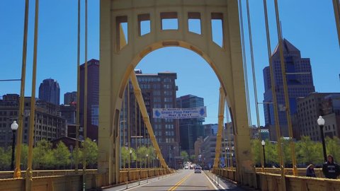 PITTSBURGH - Circa April, 2019 - A forward driving perspective on the 6th Street Roberto Clemente Bridge over the Allegheny River in Pittsburgh, Pennsylvania.  	
