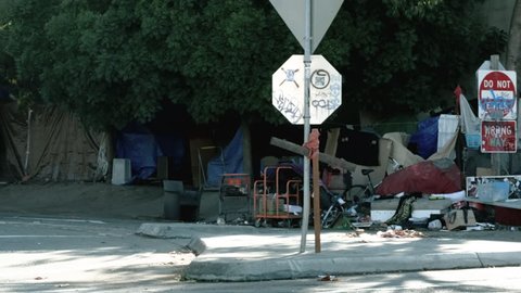 Oakland, California / United States - 10 24 2018: Oakland, California, October 24th 2018 – A homeless encampment near a freeway overpass.